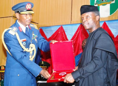 The Vice President, Prof Yemi Osinbajo being presented with a plaque by the Commandant, Armed Forces Command and Staff College, Jaji, Air Vice Marshal S. A Dambo, during the occasion
