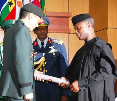 The Vice President, Prof Yemi Osinbajo presents Certificates and Awards to the graduating students at the ceremony.