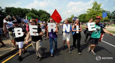 Senator Bernie Sanders supporters marching on the road to register their protest