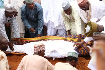 The remains of Alhaji Shinkafi being lowered to the grave
