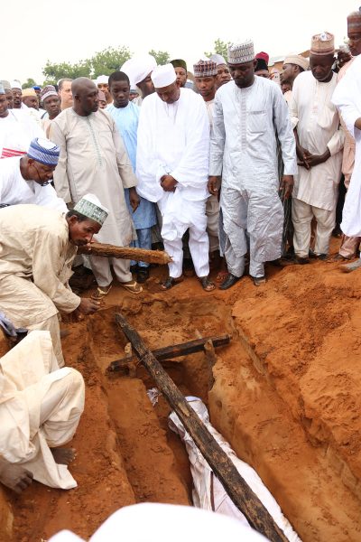 The remains of Umaru Shinkafi being covered in the grave