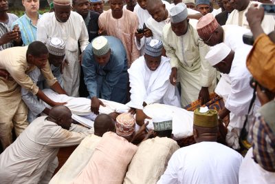 The remains of Alhaji Umaru Shinkafi being lowered to the grave