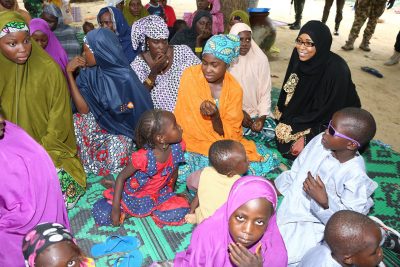 Wife of National Security Adviser, Nafisah Babagana-Monguno (in black) talks with some of the rescued under-age Boko Haram child brides at a safe house in Maiduguri, Borno State.