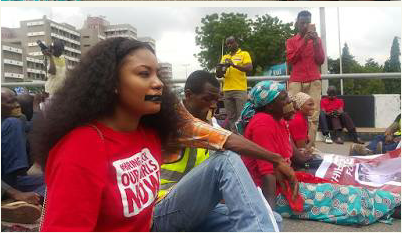 The sealed lips campaigners on the access road leading to Aso Rock