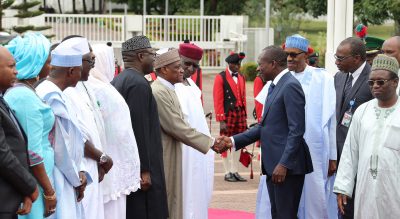 R-L; President Muhammadu Buhari  introduces the Minister of Defence Brig. Gen. Mansur Dan Ali to Mr. Patrice Talon during the visit