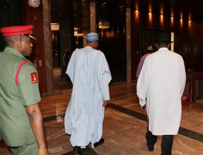 President Muhammadu Buhari and former President Goodluck Jonathan walking out of the State House, Abuja after the meeting