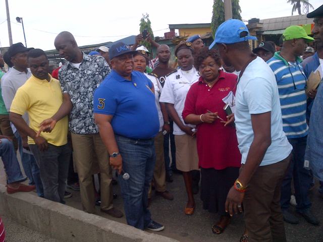 Dr. Adejare (with mic) during the sanitation exercise