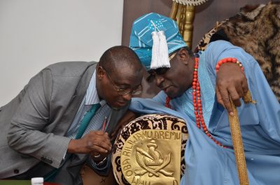 The Group Managing Director of the Nigerian National Petroleum Corporation, Dr. Maikanti Baru conferring with Oba Rilwanu Akiolu, during a visit to the Oba's palace in Lagos