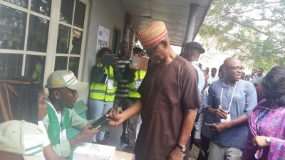 National Chairman APC, Chief John Odigie-Oyegun being accredited by an electoral officer