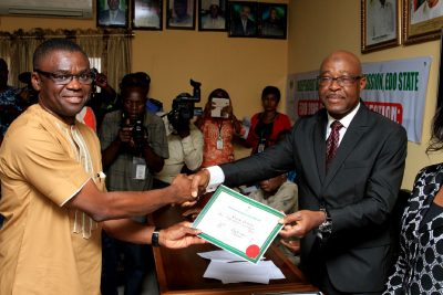 Hon. Philip Shaibu receiving his certificate of return