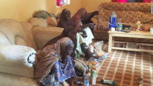 The abducted Chibok schoolgirls eating at a house in Maiduguri