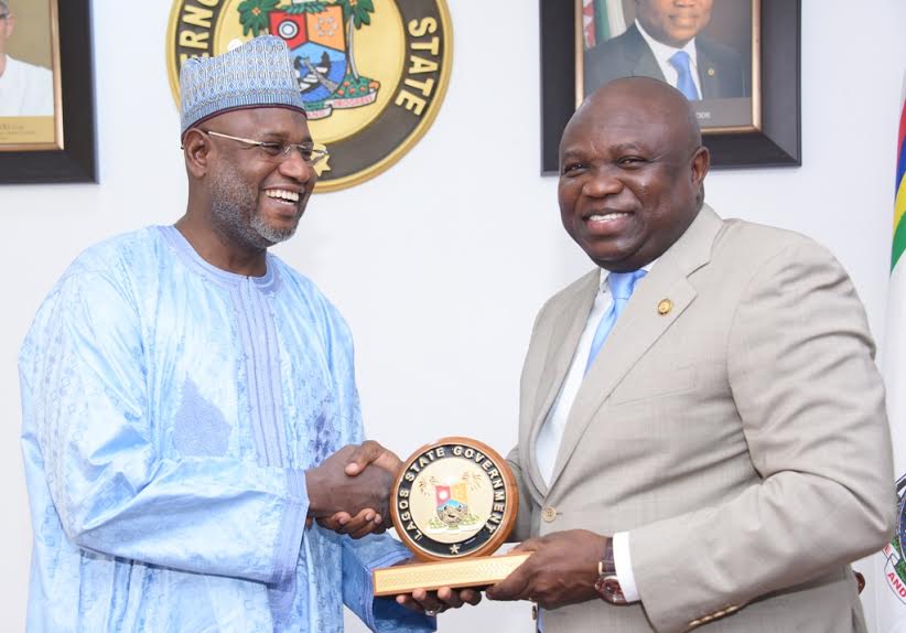 Lagos State Governor, Mr. Akinwunmi Ambode (right), presenting a State plaque to Chairman, Senate Committee on Marine Transport, Senator Sani Yerima during a courtesy visit to the Governor by the Committee, at the Lagos House, Ikeja, on Tuesday.