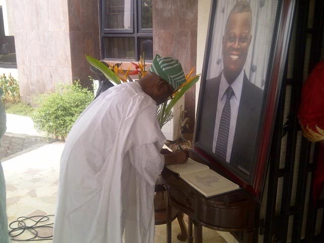 Immediate past Chairman of the Lagos State Independent Electoral Commission, LASIEC, Justice Abdulfatai Adeyinka (retd),  signing the condolence register at the burial of Chief Rasheed Gbadamosi in Ikorodu, Lagos State.