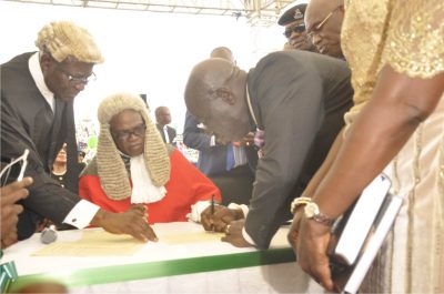 Obaseki signing the oath register after being sworn in as governor