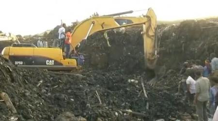 Excavators work after a landslide at a garbage dump on the outskirts of Addis Ababa, Ethiopia in this still image taken from a video