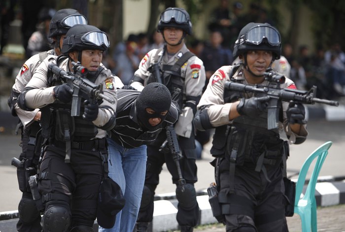 Members of the Indonesian police anti-terror squad take part in a drill at the police special forces headquarters compound in Depok