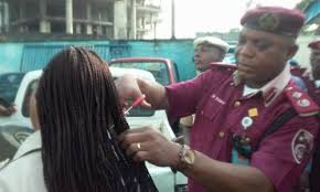 FRSC Official Cutting a Female Officer’s Hair