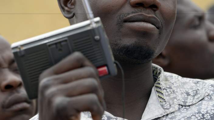 Man listening to a radio station