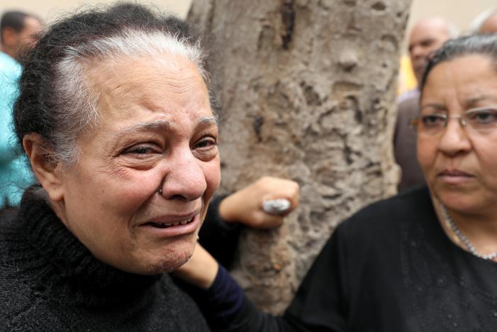 A relative of one of the victims reacts after a church explosion killed at least 21 in Tanta,