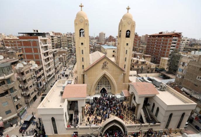 A general view is seen as Egyptians gather by a Coptic church that was bombed on Sunday in Tanta