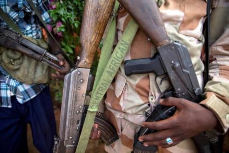 FILE PHOTO: An armed fighter belonging to the 3R armed militia displays his weapon in the town of Koui, Central African Republic