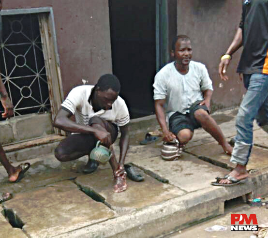 Muslim brothers performing ablutions in Mushin