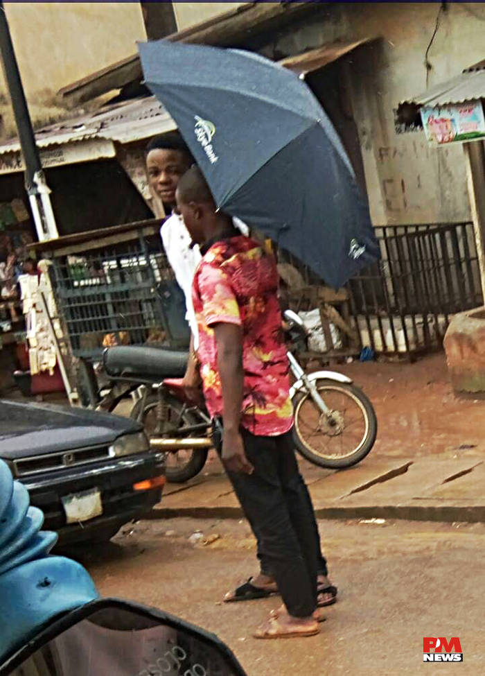 sharing an umbrella