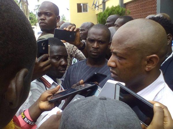 Evans being quizzed by reporters