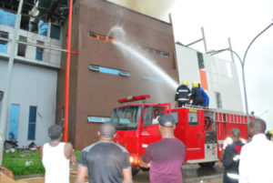 PIC.-20.-FIRE-FIGHTERS-PUTTING-OUT-FIRE-IN-ABUJA-e1498423555854