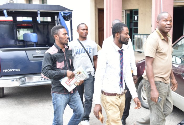 Owner of Vintage Hotel, Chief Patrick Okeze (right), and his workers – Sunday Isang (middle) and Bright Oba (left) before their arraignment at the Yaba Magistrate Court for allegedly aiding homosexuality, on Friday.