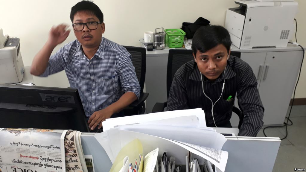 Reuters journalists Wa Lone, left, and Kyaw Soe Oo, who are based in Myanmar, pose for a picture at the Reuters office in Yangon, Myanmar, Dec. 11, 2017.