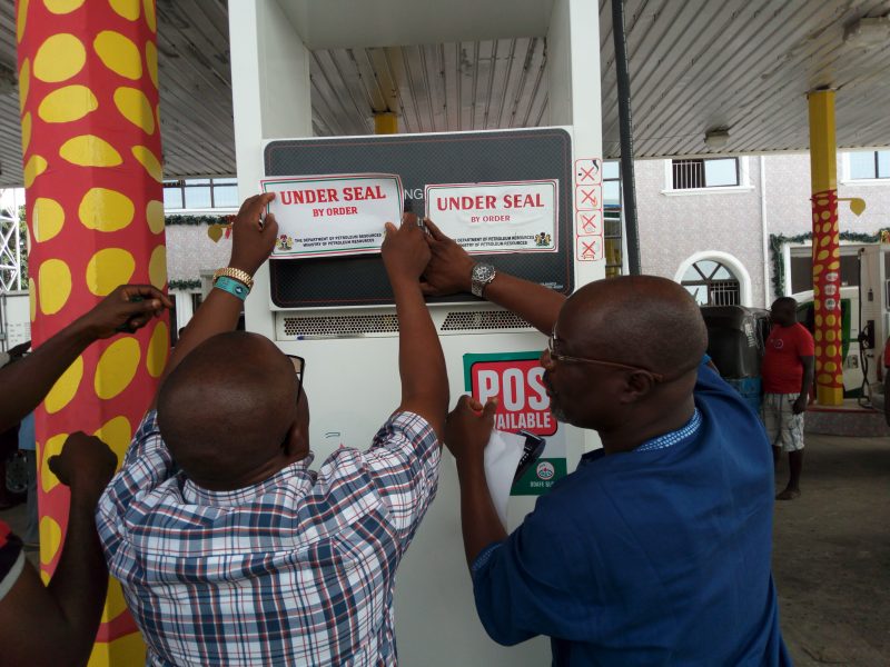 DPR officials sealing petrol station in Warri – photo NAN