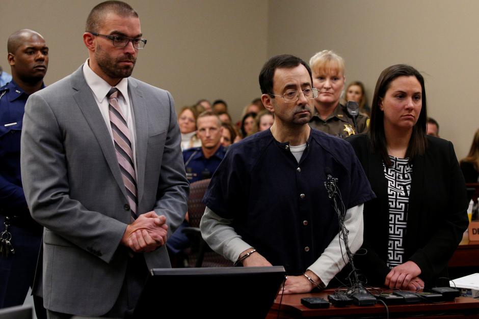 Larry Nassar, a former team USA Gymnastics doctor who pleaded guilty in November 2017 to sexual assault charges, listens as he is sentenced in Lansing