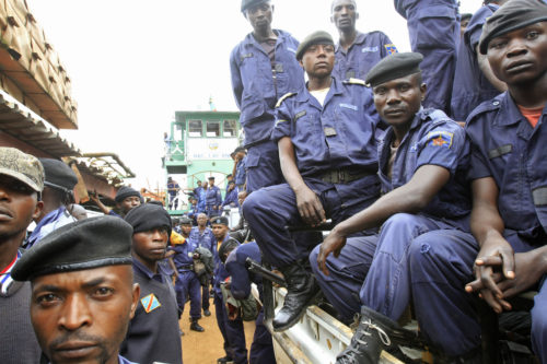 Congolese national police officers arrive at a port on Lake Kivu