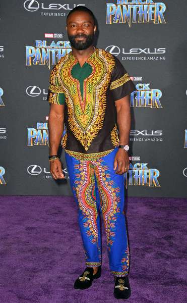David Oyelowo, Oscar-nominated actor wears a colorful African ensemble, pairing it with Christian Louboutin loafers at `Black Panther’s’’ Hollywood Premiere in Los Angeles on Monday.