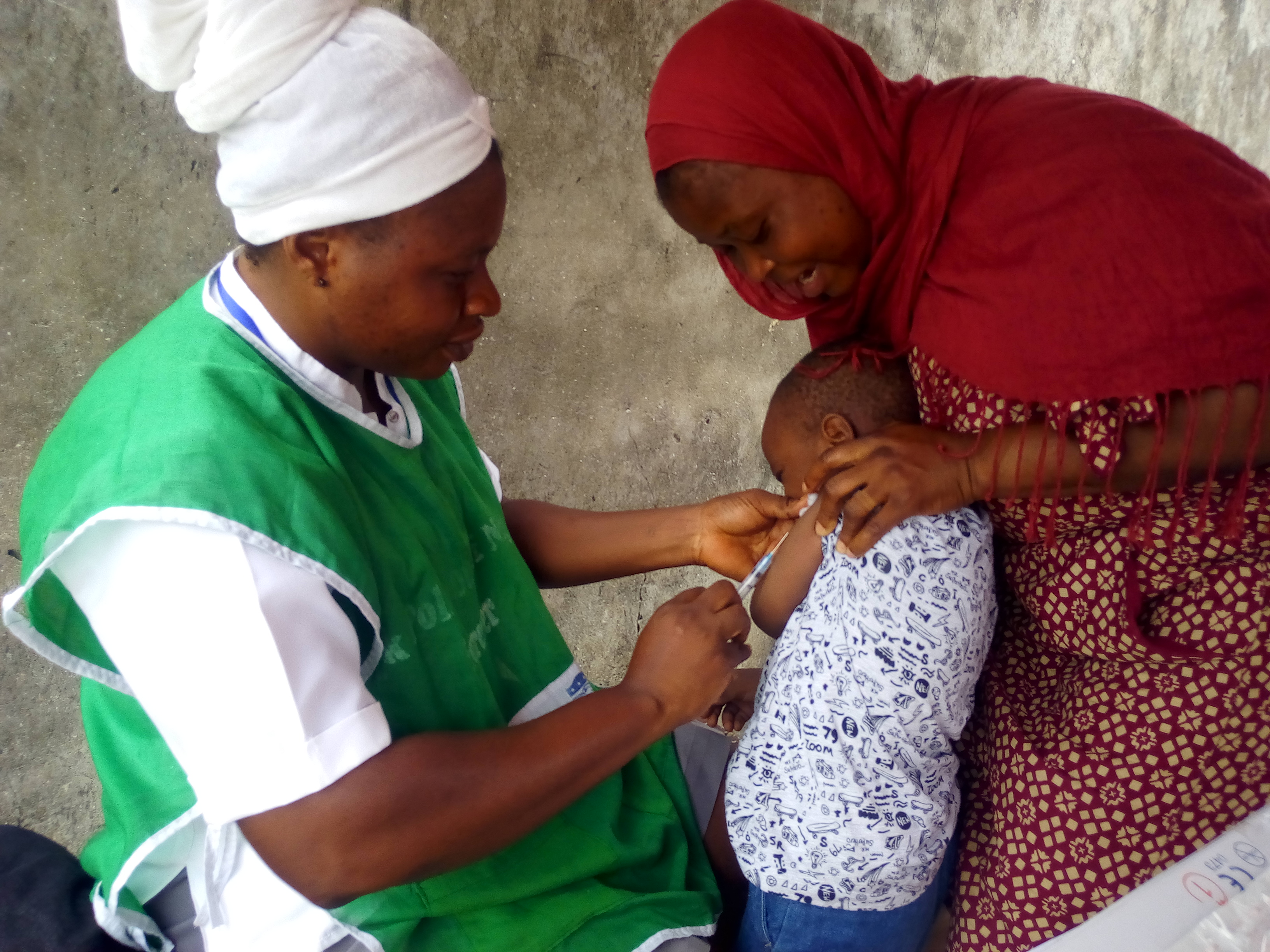 Master Chukwuemeka receiving measles vaccination at Olatilewa Street, Lawanson Bus stop, Lawanson, , Lagos. March 26, 2018 (NAN)