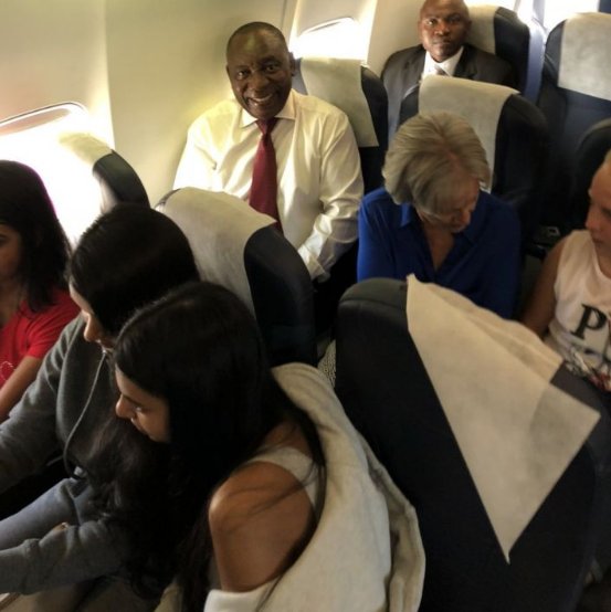 Ramaphosa-first-left-on-second-row-sitting-in-the-Economy-Class-of-Safair