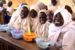 Pupils being fed under President Muhammadu Buhari government's National Home Grown School Feeding Programme (NHGSFP)