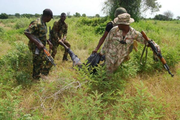One-terrorist-being-taken-out-of-the-bush-by-troops-e1537216671586