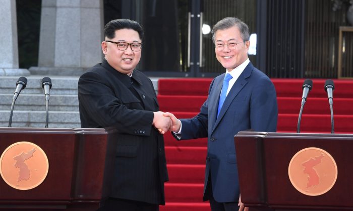 FILE PHOTO: North Korean leader Kim Jong Un and South Korean President Moon Jae-in 