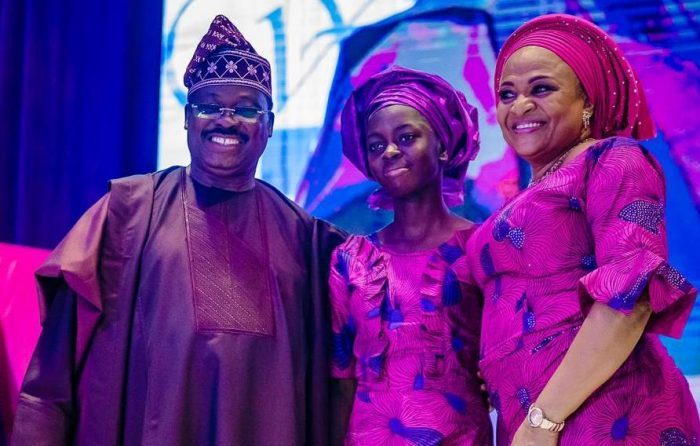 Governor Abiola Ajimobi, his wife, Florence, with Best SSCE performing female student in the state, Miss Itunuoluwa Joel in the middle.