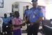 AIG In Charge Of Zone 7, Abuja, Taiwo Lakanu, presenting a cheque to a beneficiary of a deceased Police Officer in Abuja
