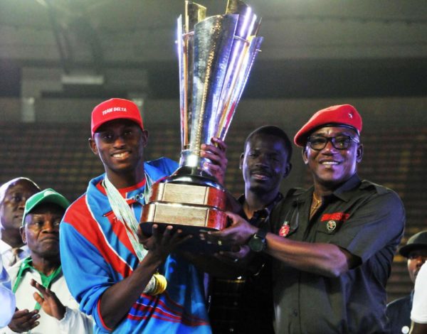 Minister-of-Sports-Dalung-presents-Team-Delta-with-the-first-prize-trophy-e1545032505378