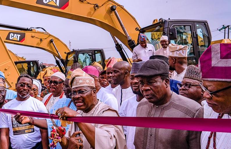 Inau Governor Abiola Ajimobi inagurating 33 extravators purchased to boost agriculture in the statde
