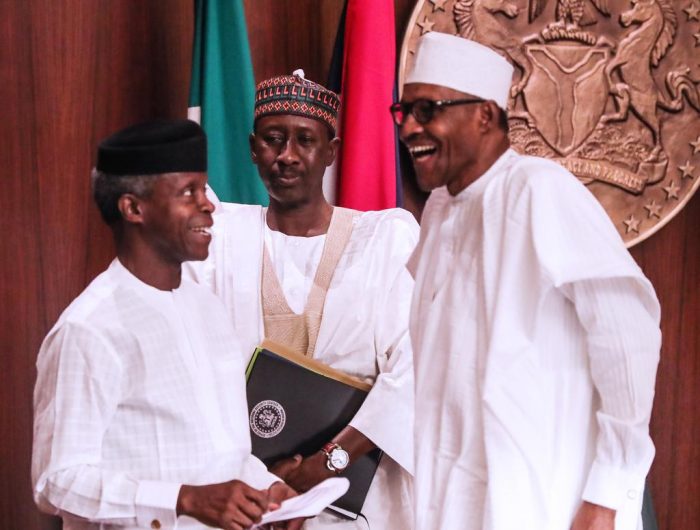 President Muhammadu Buhari shares a joke with Vice President Yemi Osinbajo during a special FEC meeting