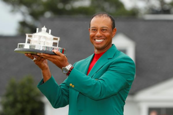Tiger-Woods-holds-the-Masters-champions-trophy-Sunday-while-wearing-the-green-jacket-after-e1555273873767