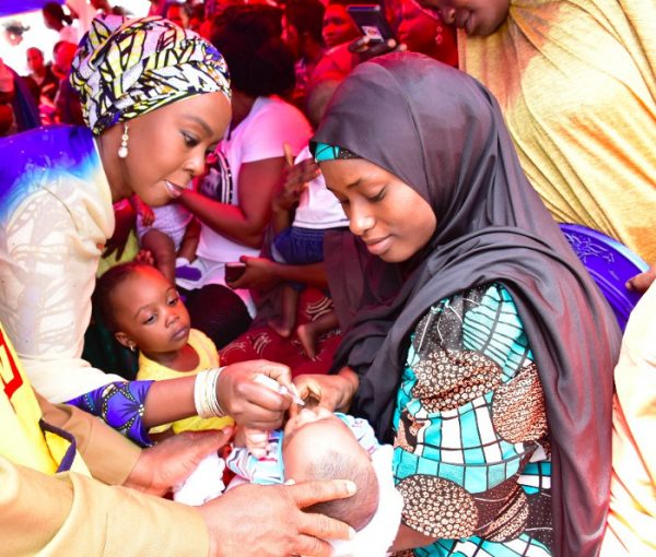 Mrs-Toyin-Saraki-administering-oral-polio-vaccine-on-a-child