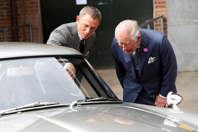 Agent 007 Bill Craig shows Prince Charles his famous Aston Martin’s car