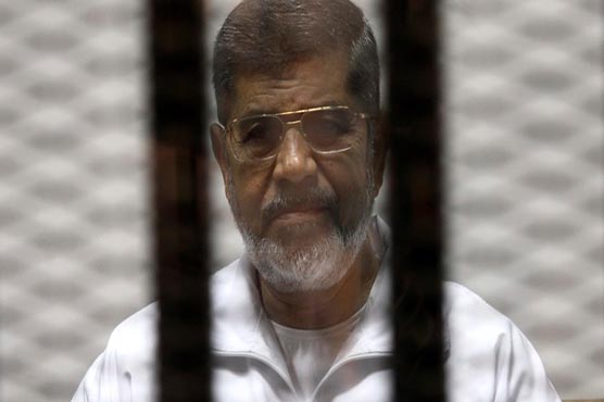 Morsi in the cage that he said made him dizzy
