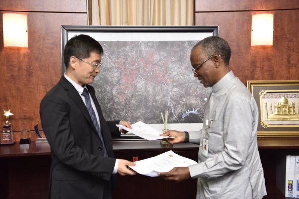 Nasir El-Rufai exchanges agreement with the representative of China Civil Engineering Construction Corporation (CCECC)
